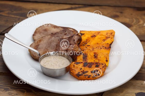 Meat tongue with sauce and pumpkin