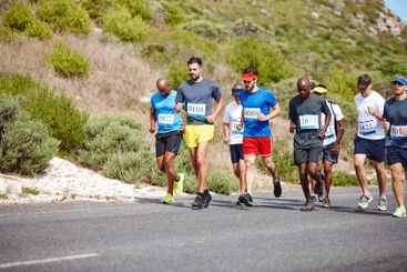 Competition, men and running group in road for fitness...