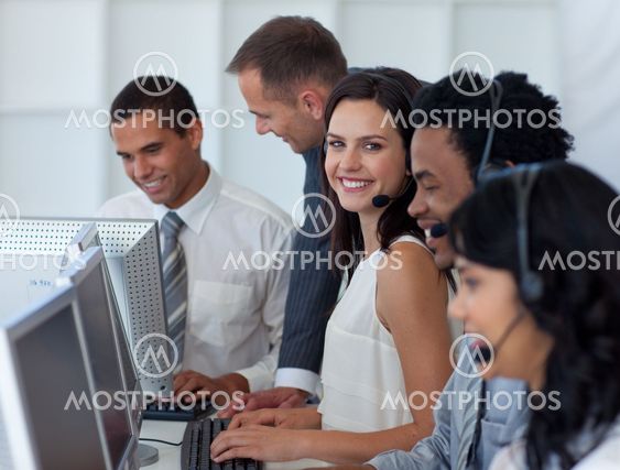 Business team working in a call center with a manager