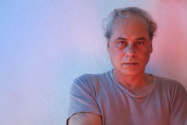 portrait with copy space of mature man with ambient...