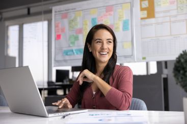 Cheerful Hispanic business project manager woman sitting...