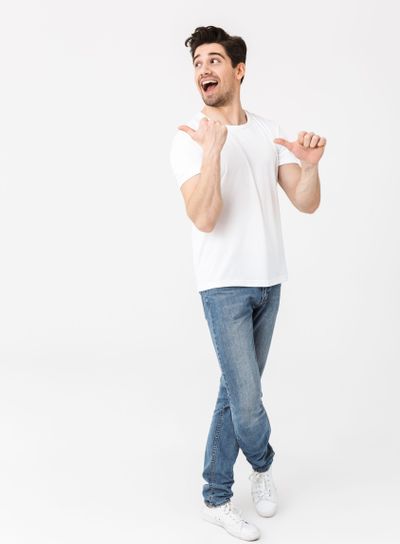 Full length portrait of a cheerful young man