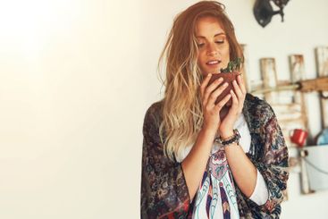 Woman, flower and hipster with pot plant on space for...