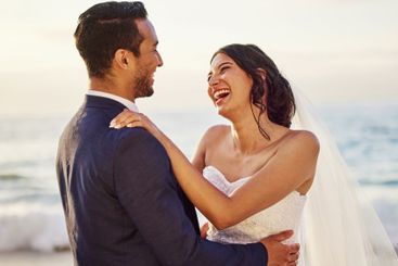 Wedding, happy and couple on beach laugh for...