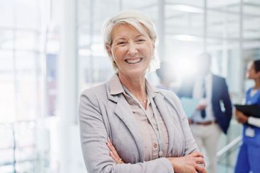 Portrait, business and woman in hospital, arms crossed...