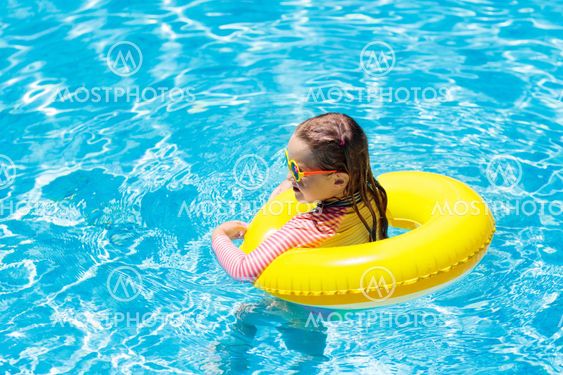 Child in swimming pool. Kids swim. Water play.