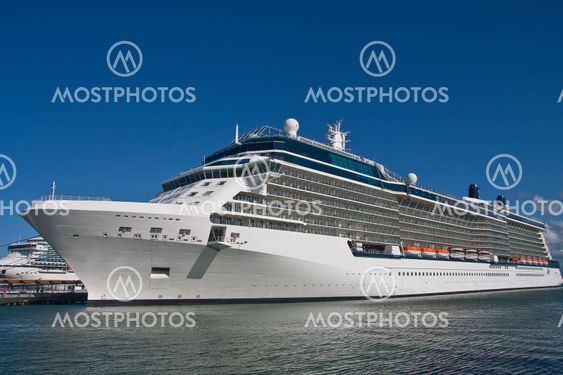 Luxury Cruise Ship Docked Under Blue Sky