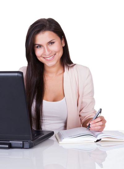 Woman sitting working at her laptop