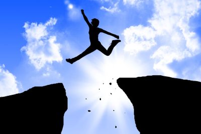 man jumping on the rocks