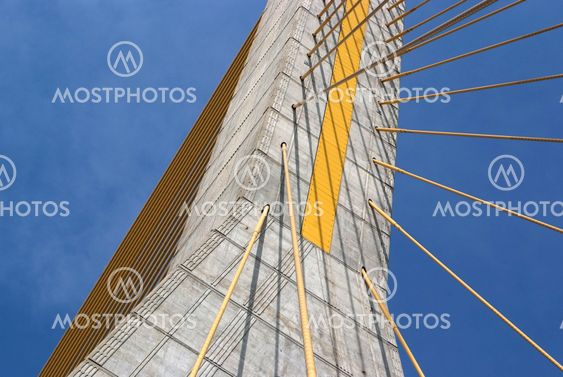 Detail of bridge construction over blue sky
