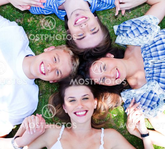 Young friends forming a circle