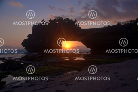 Sea sunset framed by cliffs