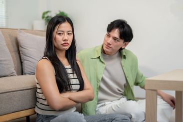 A moody Asian girl has a conflict with her boyfriend,...