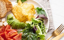 French omelet, avocado, tomatoes, avocado, and cheese on...