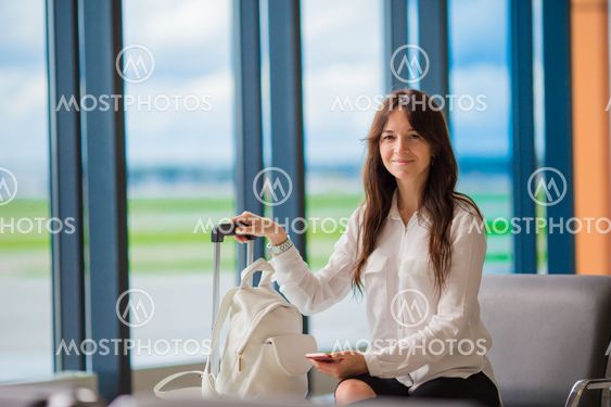 Airline passenger in an airport lounge waiting for flight...