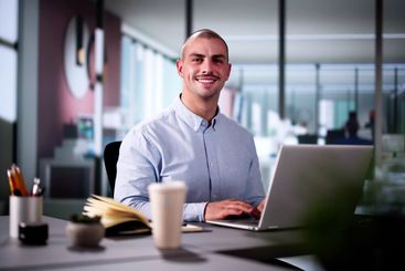 Happy Professional Man Employee Using Computer