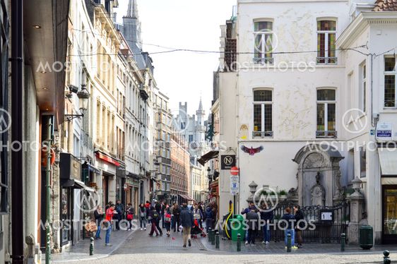 Brussels, Belgium - April 2015: Group of tourists visiting Manneken Pis or Little Man Pee, a landmark small bronze sculpture designed by Hiëronymus Duquesnoy the Elder, located near Grand Place in the city of Brussels, Belgium