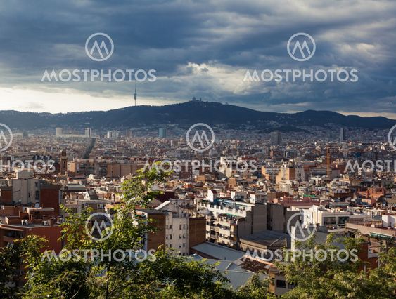 Barcelona city under cloudy sky overview