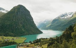 Clouds above mountain and lake