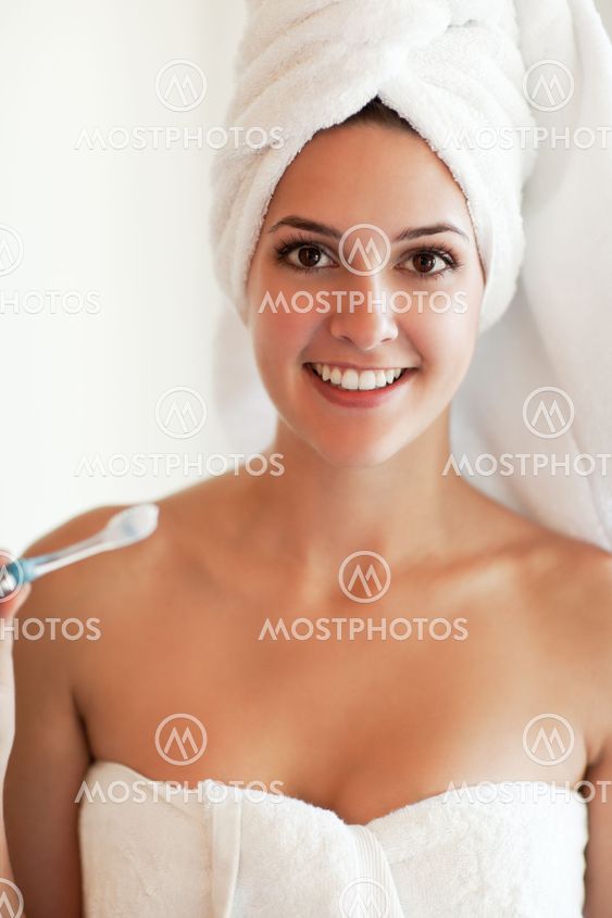 Woman holding tooth brush