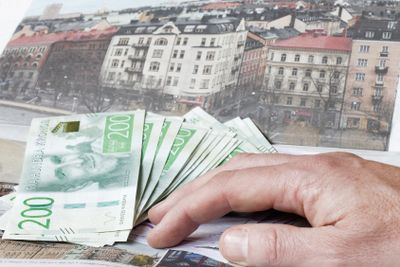 Hand holding swedish currency symbolising the expensive...