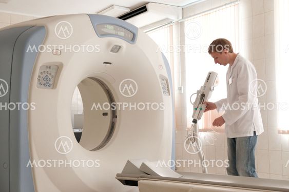 Doctor with CT scan films