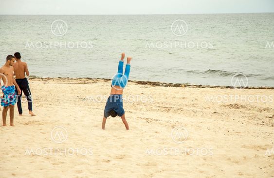 Acrobatics stunts on the sand. The beach of Sousse, Tunisia
