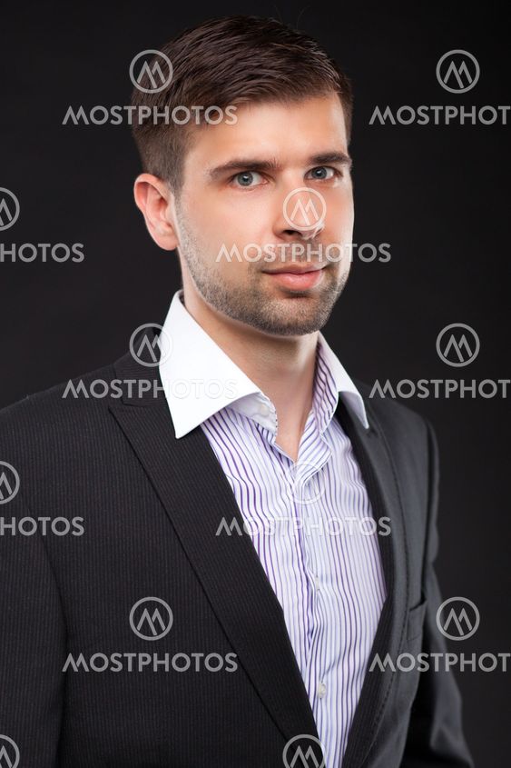 Young businessman in a black suit
