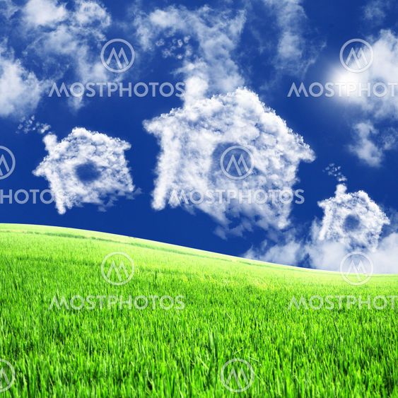 House from white clouds against blue sky