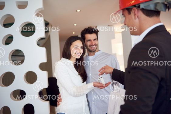 couple buying new home with real estate agent