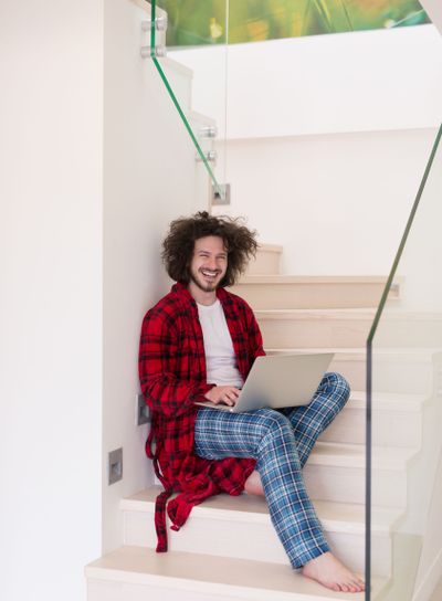 freelancer in bathrobe working from home