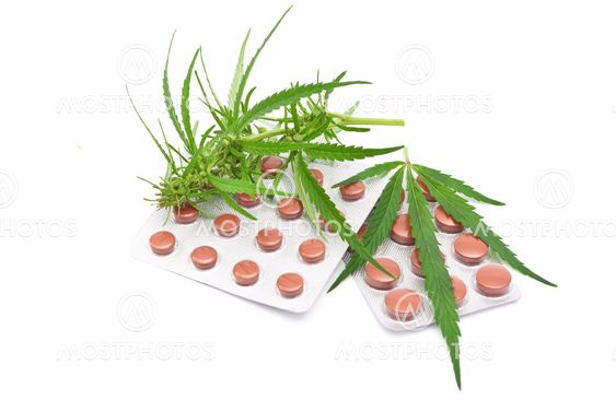 Cannabis leaf with tablets