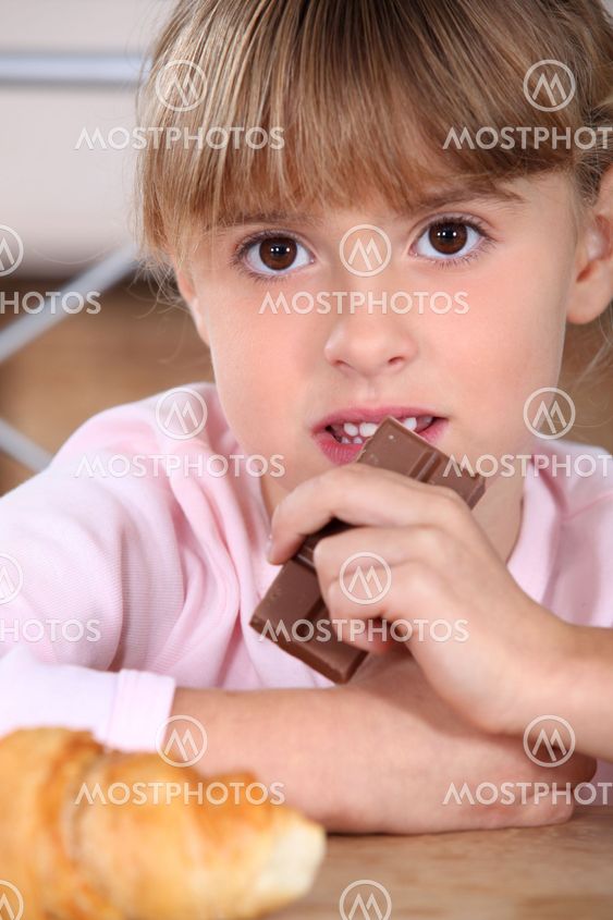 Snacking chocolate girl