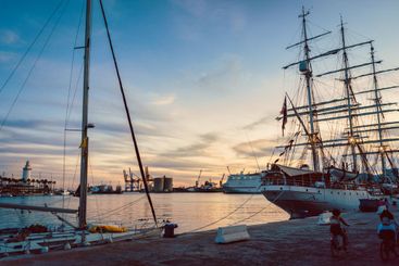 Wooden ship at nightfall in the port of Malaga