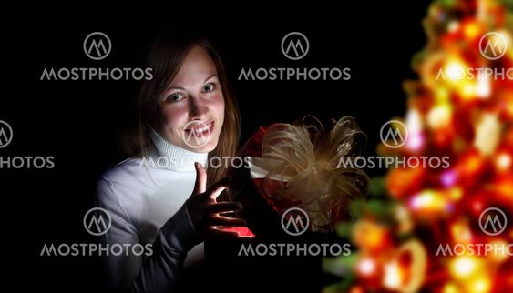 Young woman reading a magic book