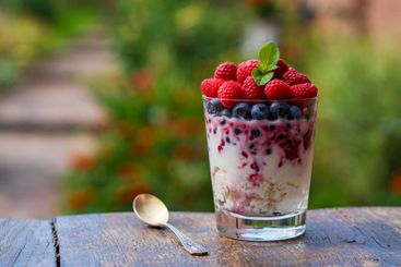 Summer dessert for breakfast in a glass of cottage...
