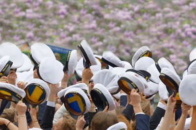 Happy swedish graduating students in a beautiful park...