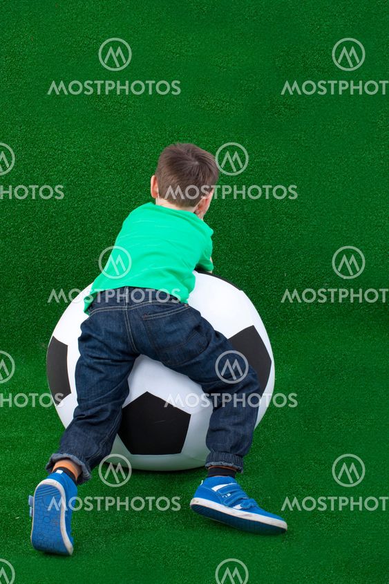 Young boy on a big ball