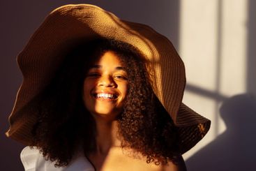 Close-up portrait of a young attractive smiling African...