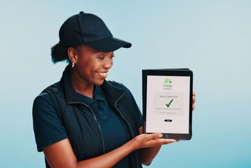 Black woman, smile and screen of tablet for delivery,...