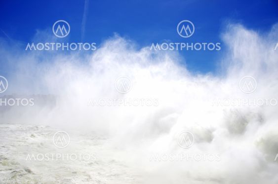 white foam of waterand blue sky