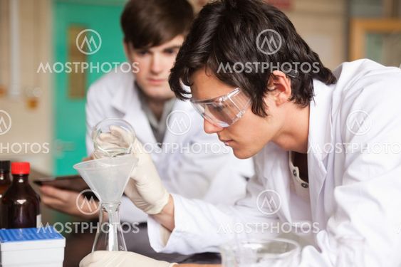 Students in chemistry making an experiment