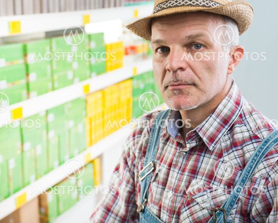 Confident farmer at supermarket