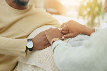 Home, closeup and couple holding hands, love and comfort...