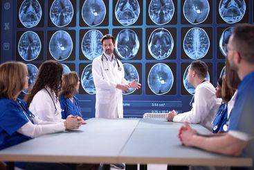Medical Team Analyzing Brain MRI Scan