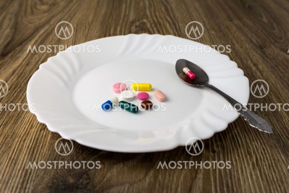 A bunch of pills on a plate