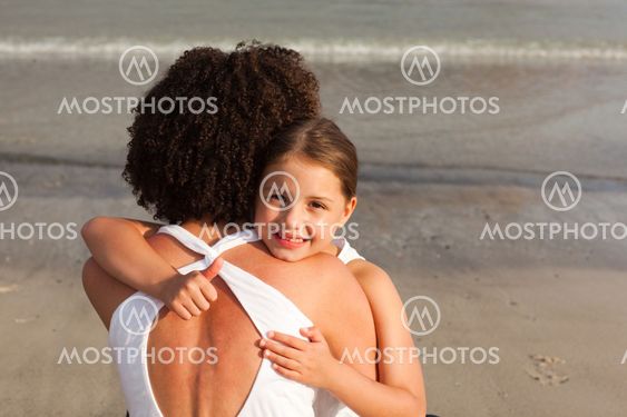 ortrait of a smiling Daughter Hugging her mother