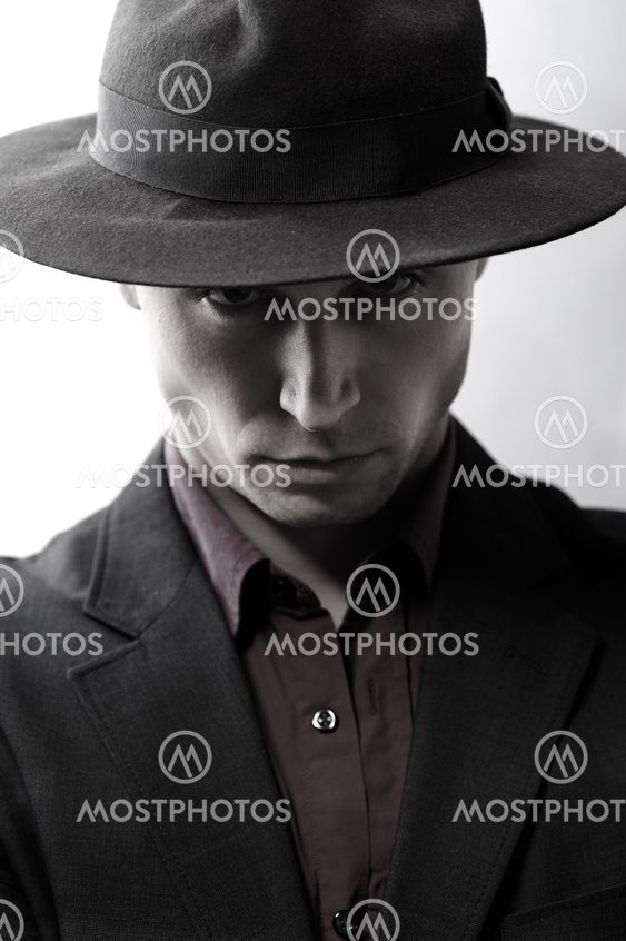 Man with a hat looking at camera