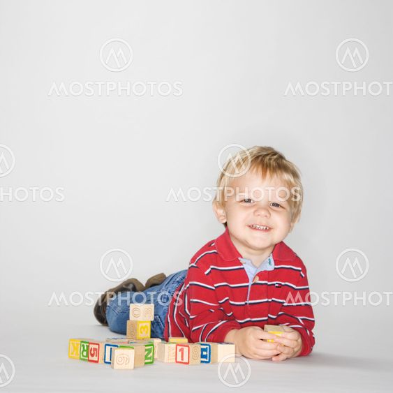 Boy playing with blocks.
