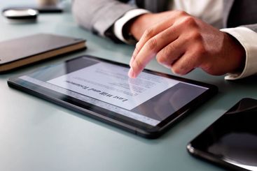 The young African American man is filling out a close-up...